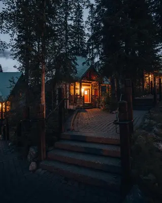 a home with a staircase leading to a house with lights at Emerald Lake Lodge in Field