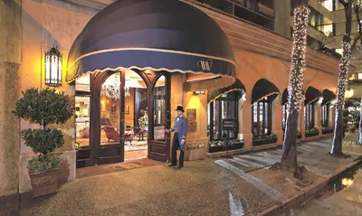 a man standing in front of a building at Wedgewood Hotel & Spa - Relais & Chateaux in Vancouver