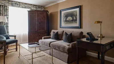 a living room with a couch and a table at Wedgewood Hotel & Spa - Relais & Chateaux in Vancouver