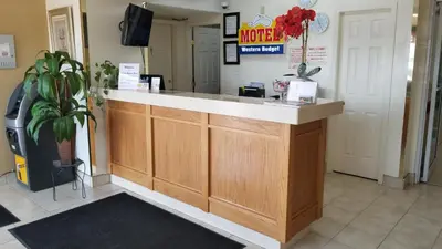 a lobby with a counter in a store at Western Budget Motel Cold Lake in Cold Lake