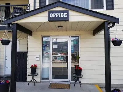 an office building with a sign over the door at Osoyoos Lakeview Inn & Suites in Osoyoos