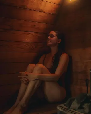 a woman sitting in a corner of a room at The Sentinel in Kaslo