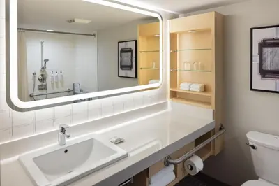 a bathroom with a sink and a mirror at Delta Hotels by Marriott Grand Okanagan Resort in Kelowna