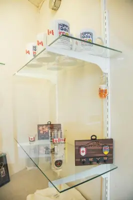 a glass shelf with items on it in a room at Happy Day Inn in Burnaby