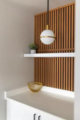 a bathroom with white shelves and a pendant light at The Thompson Hotel in Kamloops