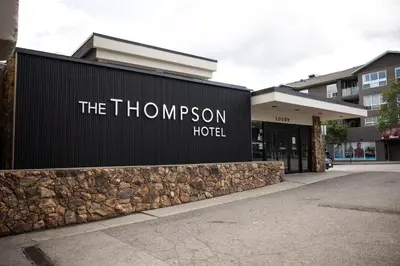 a sign for the thompson hotel in front of a building at The Thompson Hotel in Kamloops