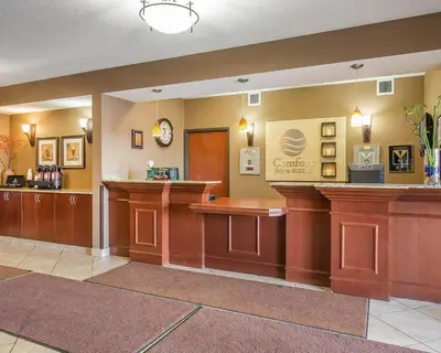 a lobby of a dental office with a waiting area at Comfort Inn & Suites in Airdrie