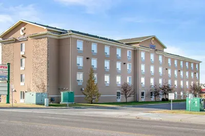 a large building on the side of a street at Comfort Inn & Suites in Airdrie