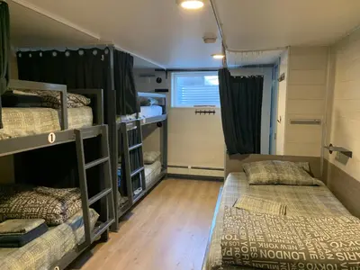 a room with two bunk beds in it at Jasper Downtown Hostel in Jasper