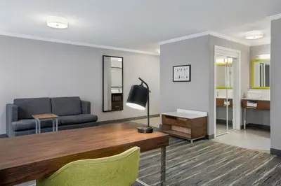 a living room with a couch and a table at Hampton Inn by Hilton Kamloops in Kamloops