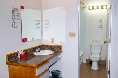 a bathroom with a sink and a toilet at Spanish Villa Resort in Penticton