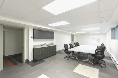an office meeting room with a table and chairs at HI Edmonton - Hostel in Edmonton