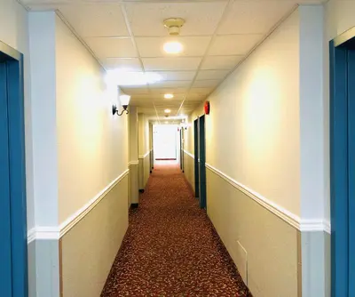 a hallway in a hospital with a hallwayngth at Days Inn by Wyndham Kamloops BC in Kamloops