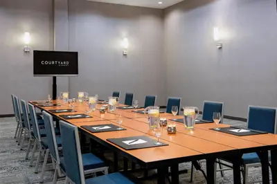 a large conference room with a long table and chairs at Courtyard by Marriott Edmonton West in Edmonton