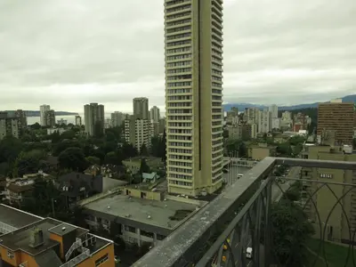a view of a city with a tall building at Tropicana Suite Hotel in Vancouver