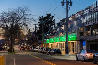 a city street with cars parked on the street at Ocean Promenade Hotel in White Rock