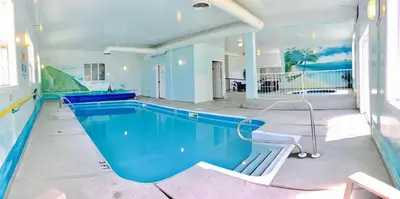 a large swimming pool in a house at Country View Motor Inn in Kamloops