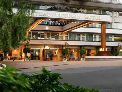 a hotel with a sign on the front of it at Chateau Victoria Hotel & Suites in Victoria