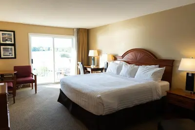 a hotel room with a bed and a window at Inn on Long Lake in Nanaimo