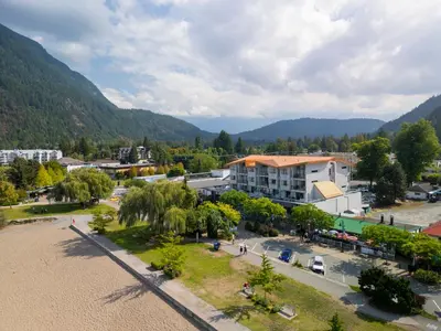an aerial view of a town with mountains in the background at Harrison Beach Hotel in Harrison Hot Springs