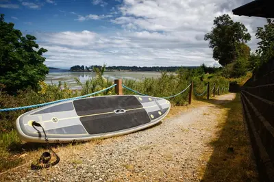 a boat sitting on the side of a road at Sunrise Ridge Waterfront Resort in Parksville