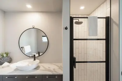 a bathroom with a sink and a mirror at Sunrise Ridge Waterfront Resort in Parksville