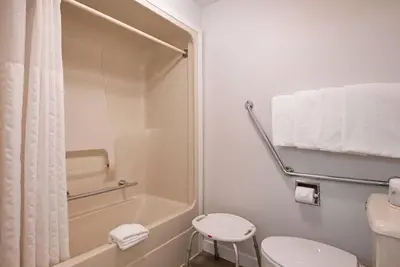 a bathroom with a shower and a toilet and a sink at Travelodge by Wyndham Kamloops Mountview in Kamloops