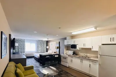 a room with a kitchen and a living room at Quality Inn in Kamloops