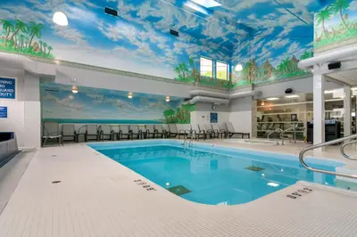 a pool in a hotel room with a ceiling covered inpired at Best Western Premier Aberdeen Kamloops in Kamloops