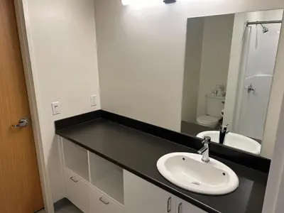a bathroom with a sink and a mirror at UBC Okanagan Campus in Kelowna