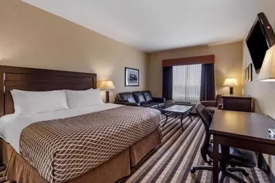 a hotel room with a bed and a desk at Best Western Plus Meridian in Lloydminster