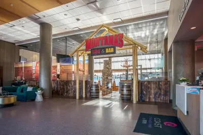 a mall with a sign that reads winnings pork and dip at Coast Chilliwack Hotel by APA in Chilliwack