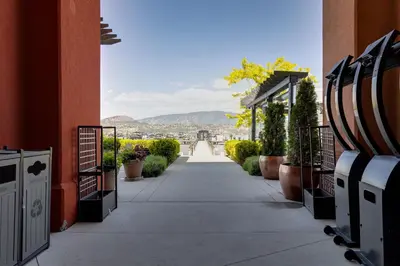 a walkway between two buildings with a view at Manteo at Eldorado Resort in Kelowna