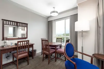 a room with a table and chairs and a dining room at Manteo at Eldorado Resort in Kelowna