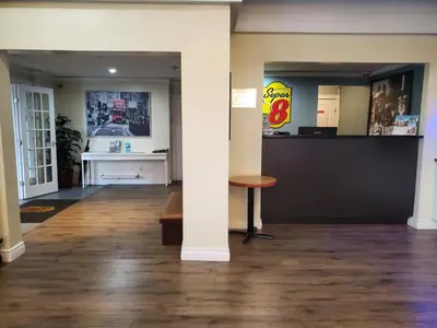 a column in a room with a table and a counter at Super 8 by Wyndham Duncan in Duncan