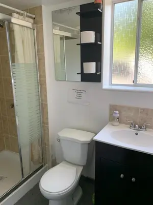 a bathroom with a toilet and a sink and a shower at Vancouver Backpacker House - 10 min walk to Metrotown skytrain station in Burnaby