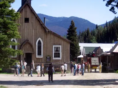 a group of people standing outside of a barn at Mountain Thyme Getaway in Barkerville