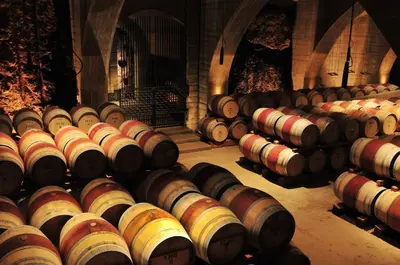 a row of wine barrels in a large room at Holiday Inn Express & Suites Kelowna - East by IHG in Kelowna