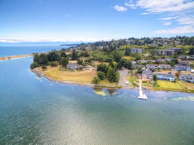 an aerial view of a small island in the water at Birds of a Feather Victoria Oceanfront Studio Suites in Colwood