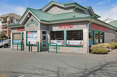 a wine store with a green roof at Sandman Hotel Langley in Langley