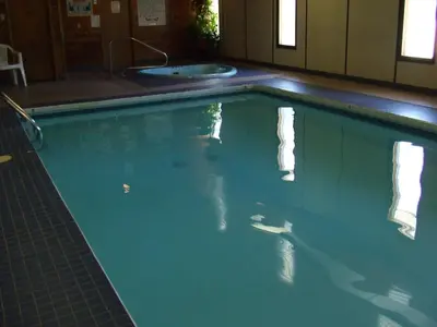 a swimming pool with a tub and a sink at Mary's Motel in Golden