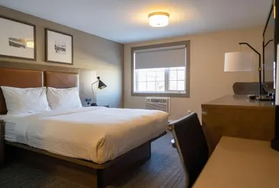 a hotel room with a bed and a window at Best Western Gold Rush Inn in Whitehorse