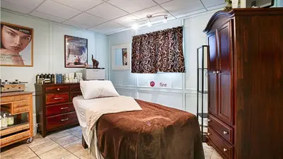 a room with a bed and a dresser in it at Best Western Gold Rush Inn in Whitehorse