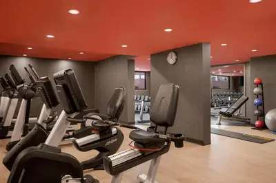 a gym with treadmills and elliptical machines at Hilton Vancouver Airport in Richmond