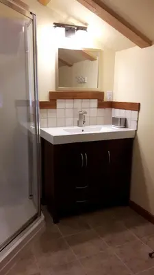 a bathroom with a sink and a mirror at Tschurtschenthaler Lodge in Golden