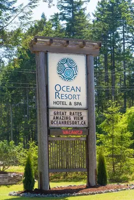 a sign for an ocean resort hotel and spa at Ocean Resort in Oyster Bay