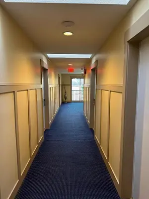 an empty hallway in a hospital with a hallwaygue at Canadian Inn in Surrey