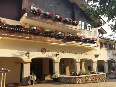 a building with flower boxes and balconies on it at Sun Peaks Lodge in Sun Peaks