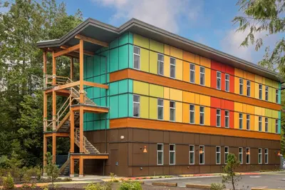 a multicolored building with a fire escape at Hotel Zed Tofino in Tofino