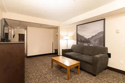 a living room with a couch and a coffee table at Super 8 by Wyndham Prince George in Prince George